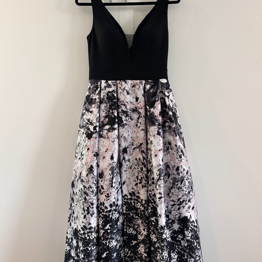 (2) N - Xscape Black and White Sleeveless V-Neck Maxi Dress